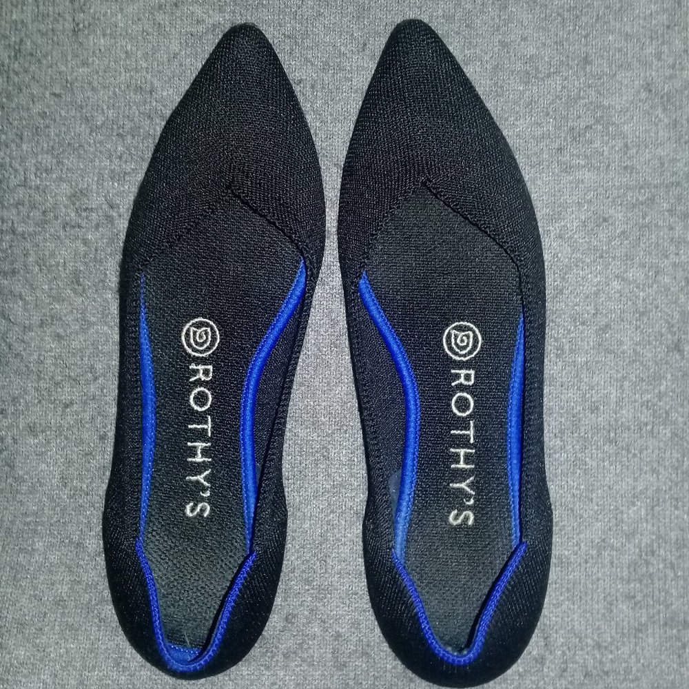 rothy's pointed toe black flats with navy blue accent